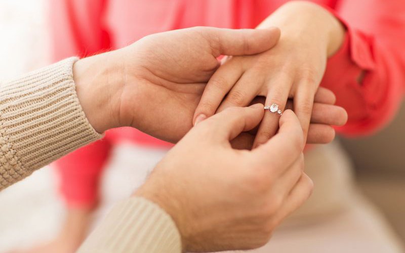 man giving diamond ring to his women